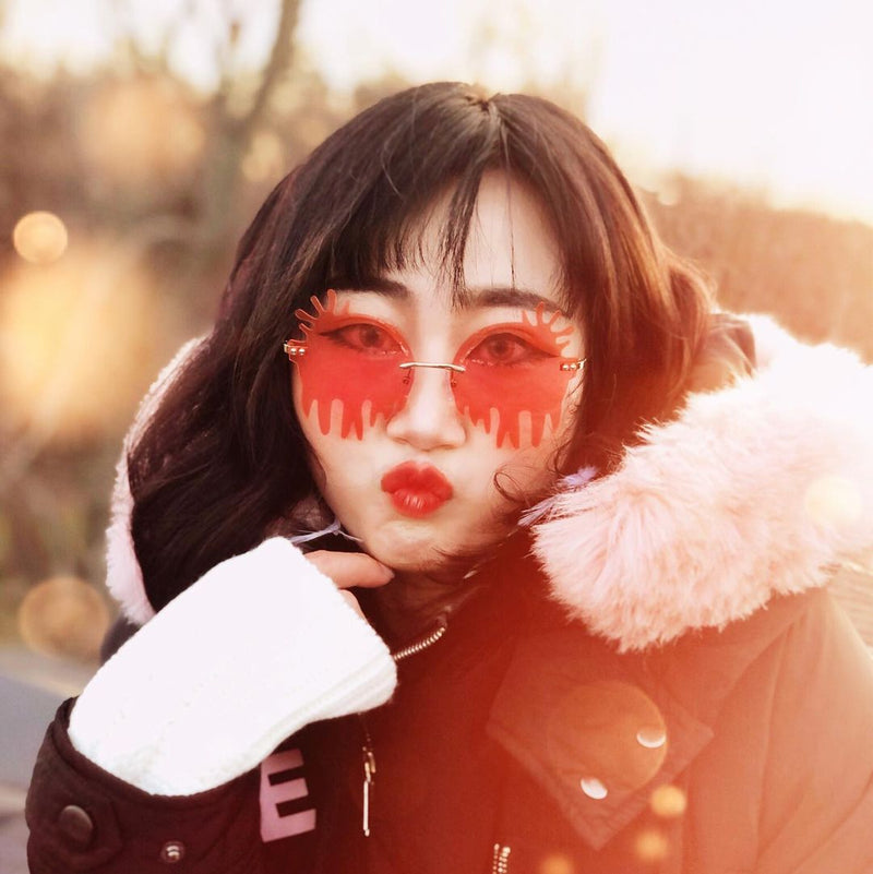 Gafas de sol de goteo redondo con lentes teñidas de color con efecto de goteo de fusión sin montura D077